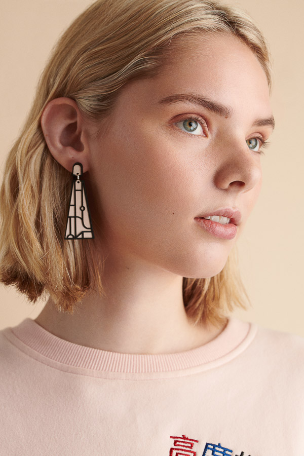 Natural Makeup beauty portrait, blond hair, pink earrings, pink jumper